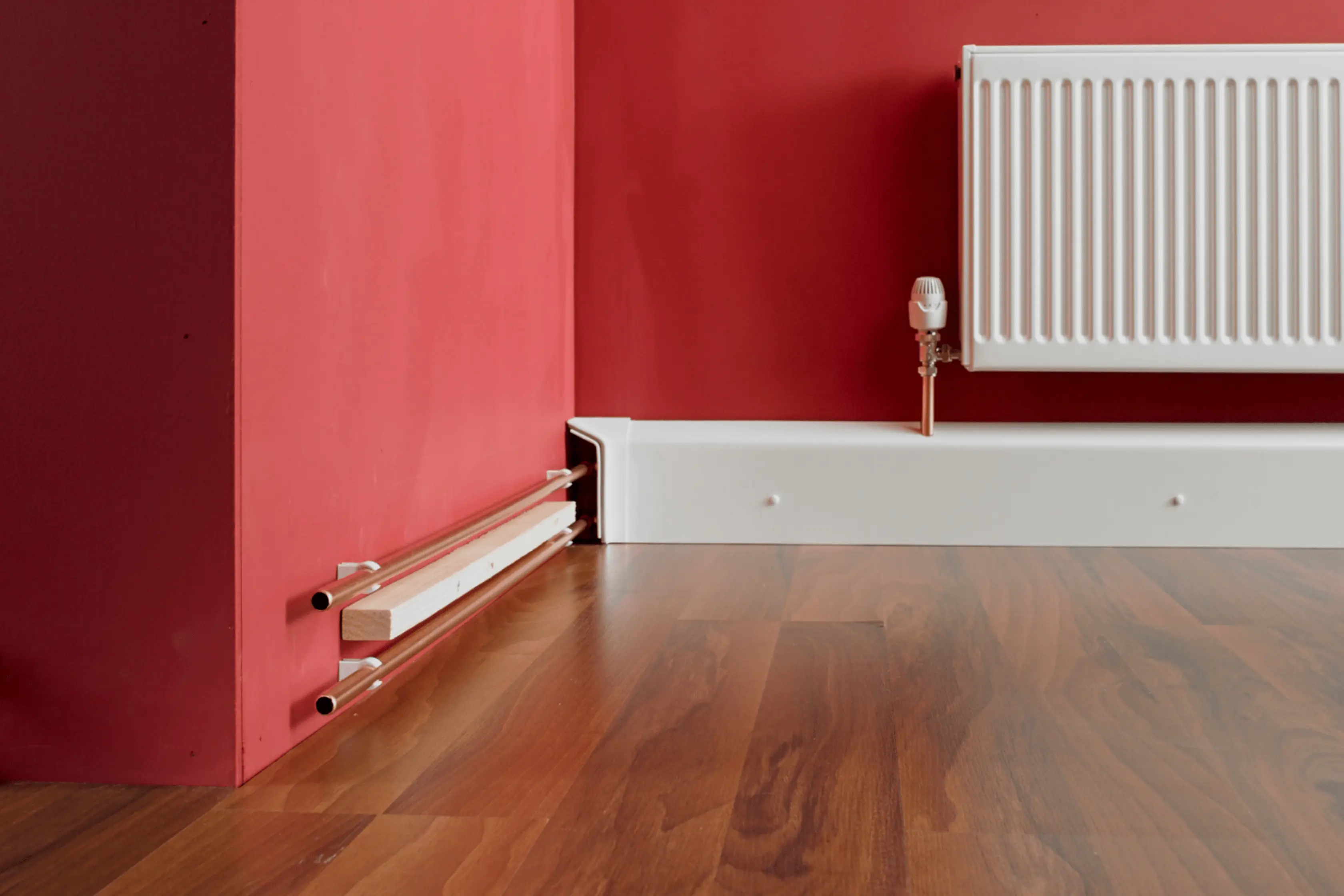 Homeowners With Adaptive Skirting Boards To Hide Pipes